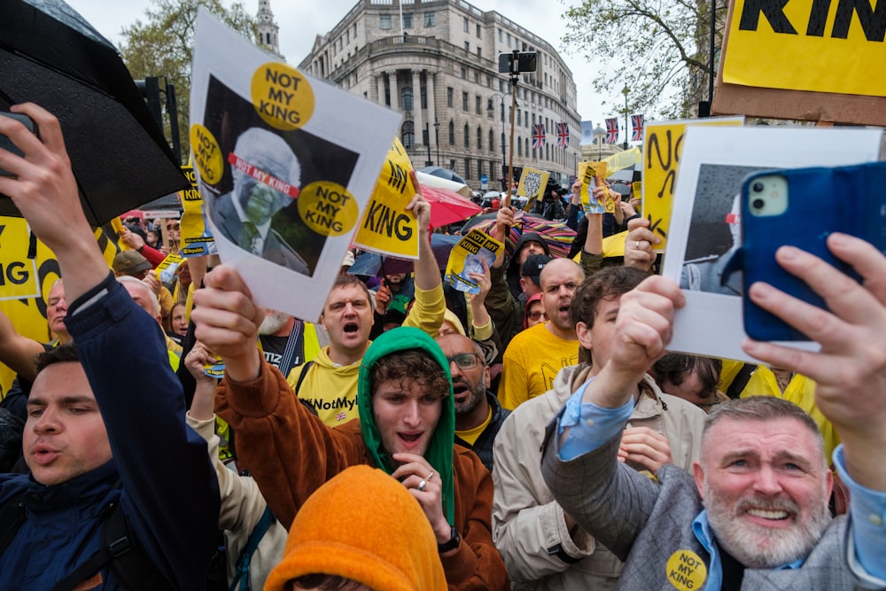 a large group of people holding up signs