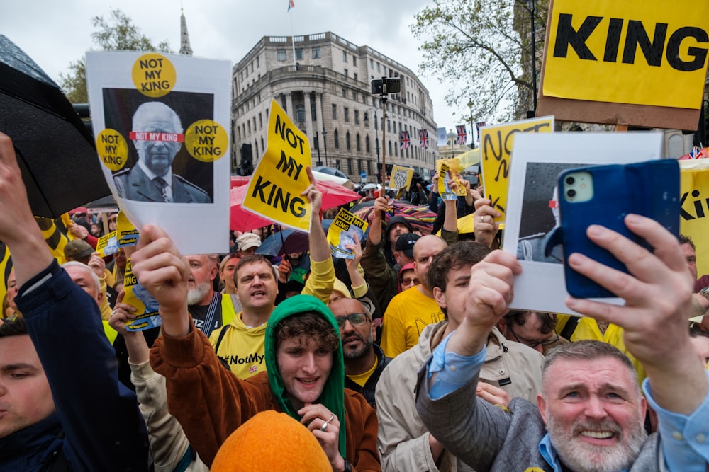 a large group of people holding up signs