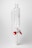 A clear glass laboratory separatory funnel with a cylindrical main body and a stopcock featuring red and white knobs. The apparatus is used for separating liquid mixtures.
