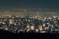 A panoramic view of a bustling cityscape at night.