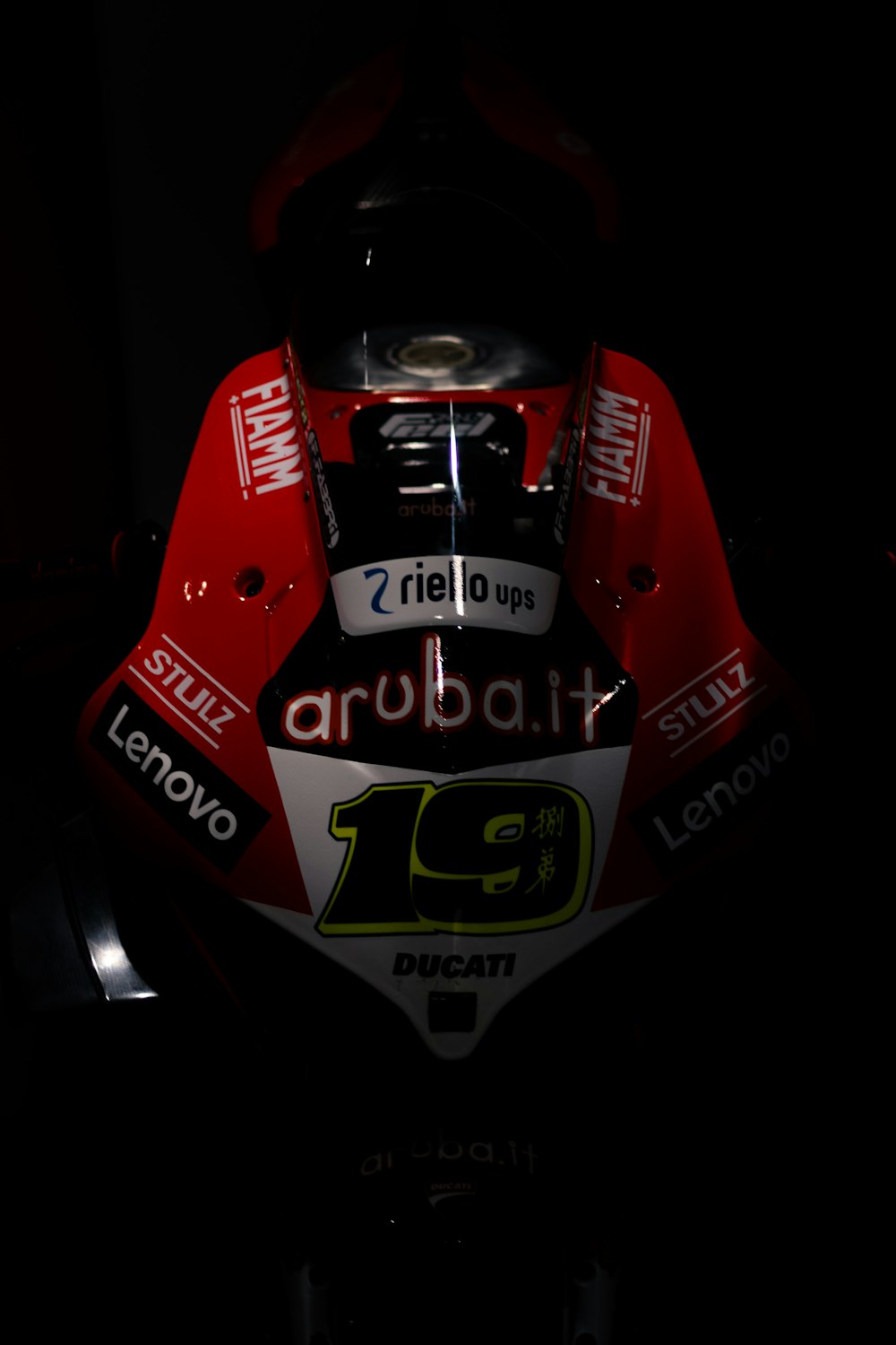 a close up of a motorcycle in the dark