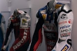 A high-performance racing suit displayed on a mannequin.