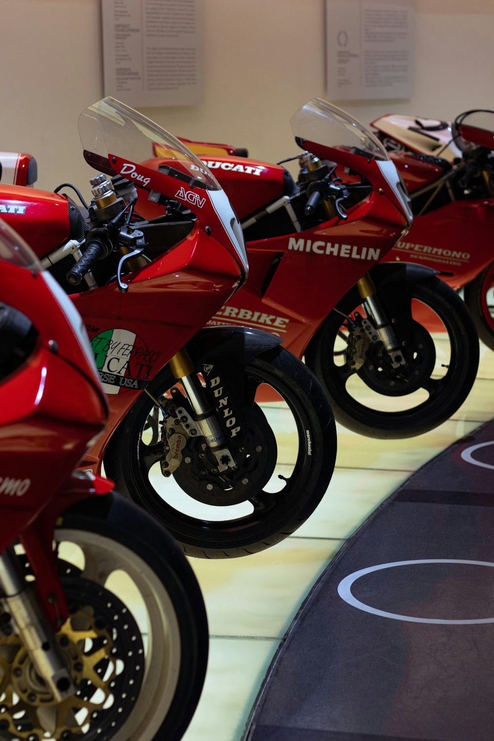 a row of red motorcycles parked next to each other