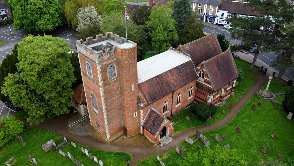 an aerial view of an old brick church