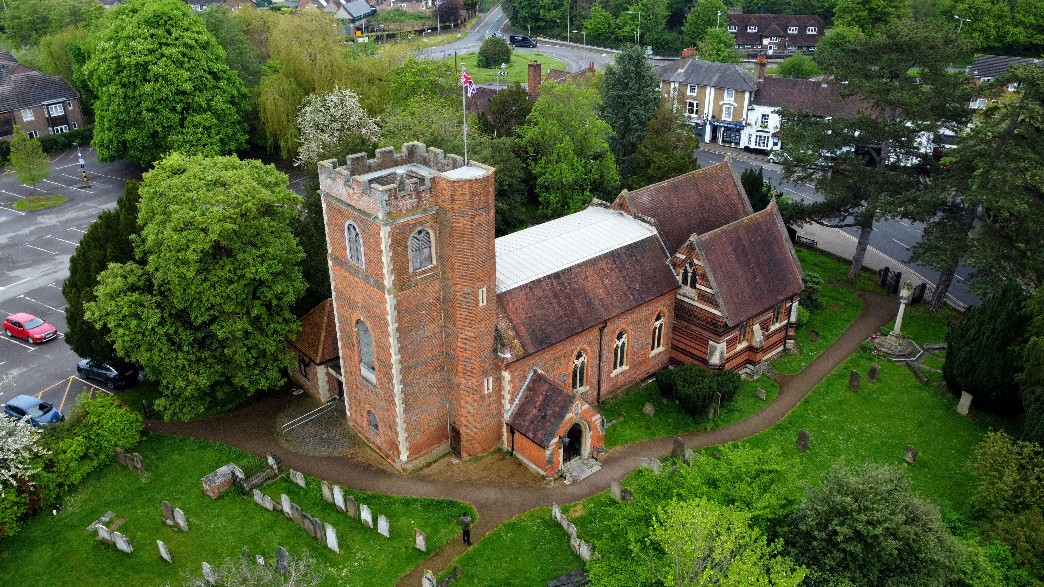 An aerial view of an old church in a cemetery photo Free Chalfont st
