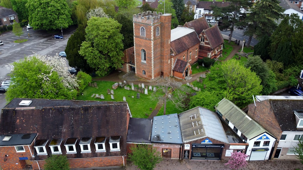 an aerial view of a church and cemetery