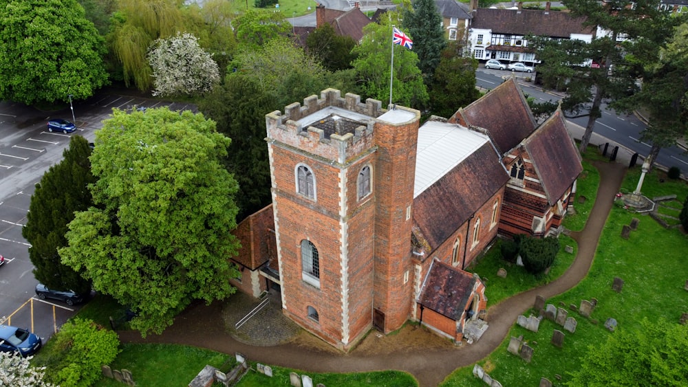 an aerial view of an old brick church