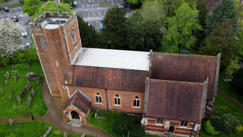 an aerial view of an old brick church