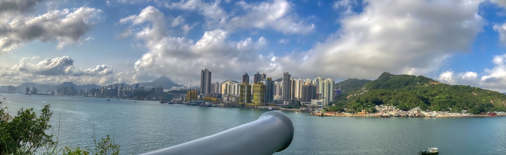 a large body of water with a city in the background