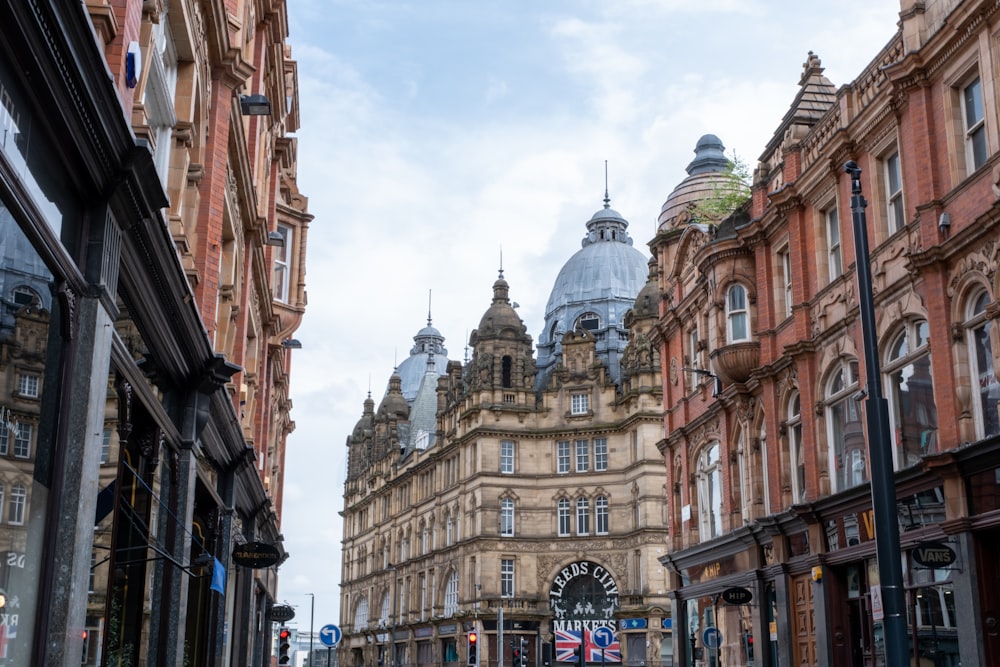 a city street with a clock tower in the background