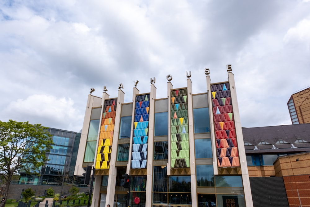 a multicolored building with a sky background