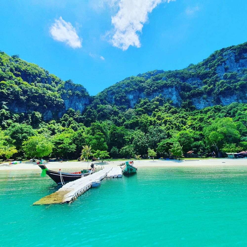 a couple of boats that are sitting in the water