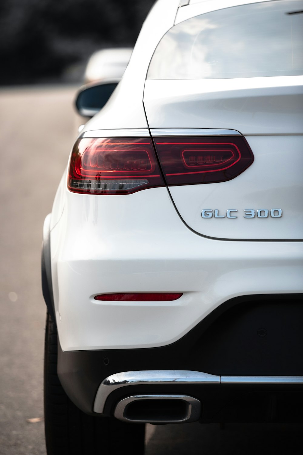 a close up of the tail lights of a white car