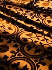 A beautifully restored tile floor shining under natural light in a modern kitchen.