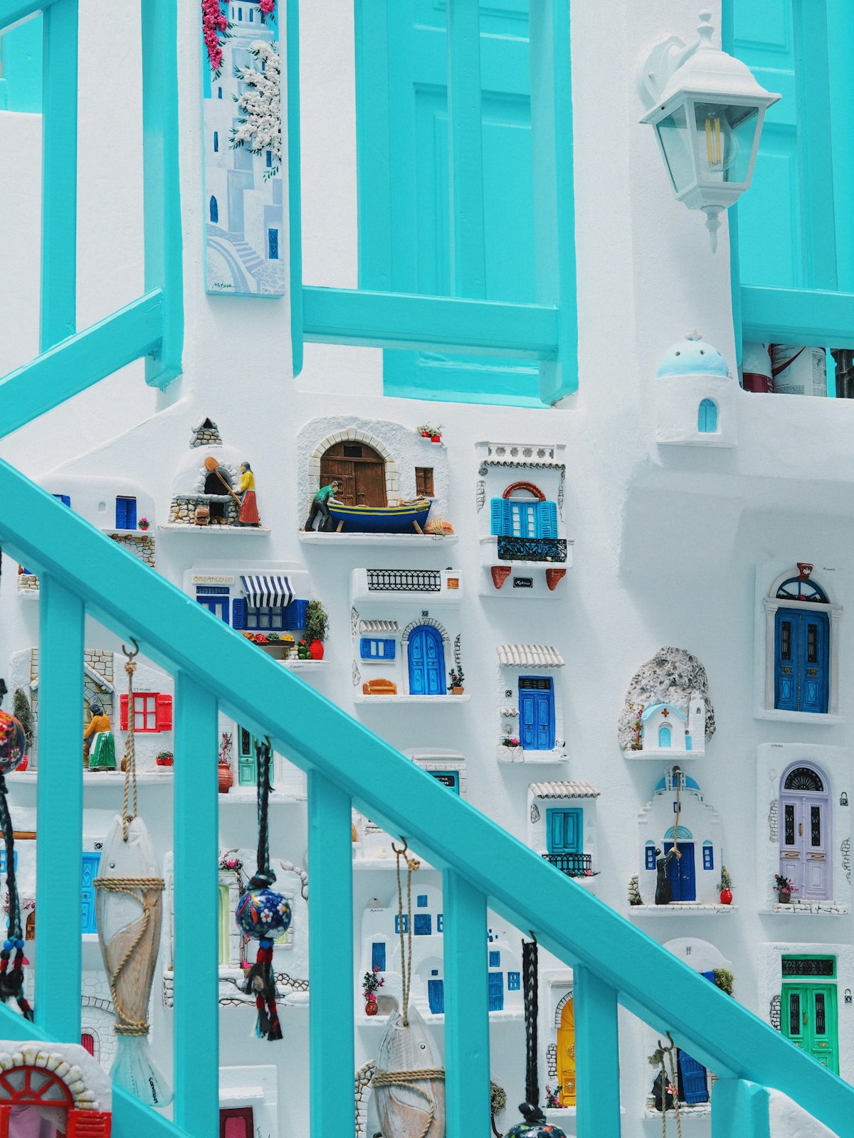 Mykonos January — whitewashed staircase with blue shutters in the quiet off-season Chora