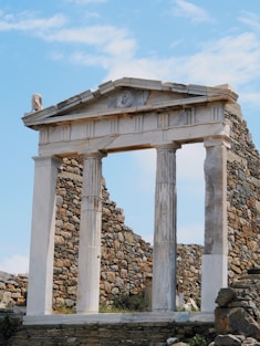 a stone structure with a clock on top of it