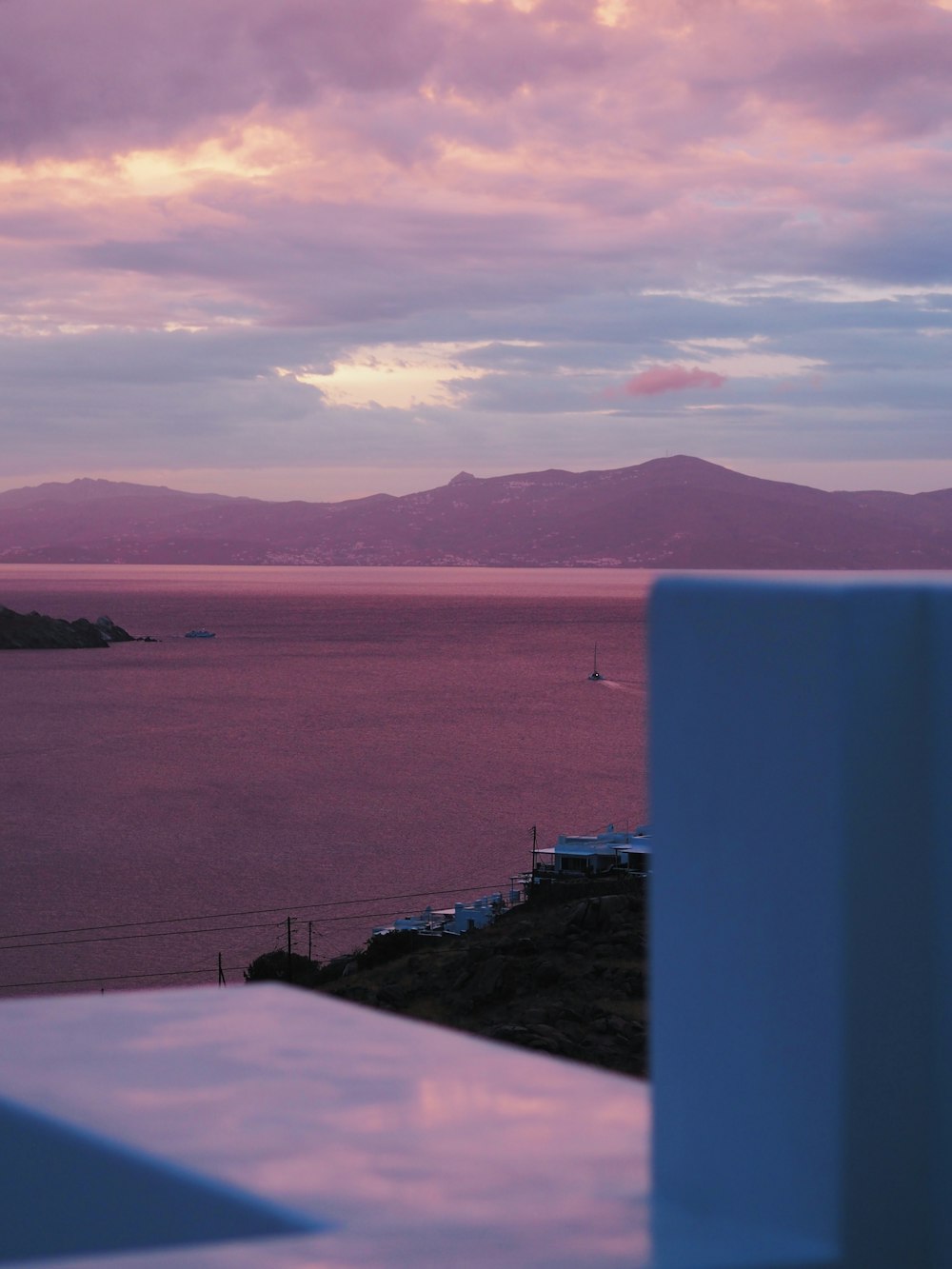 a view of a body of water with mountains in the background