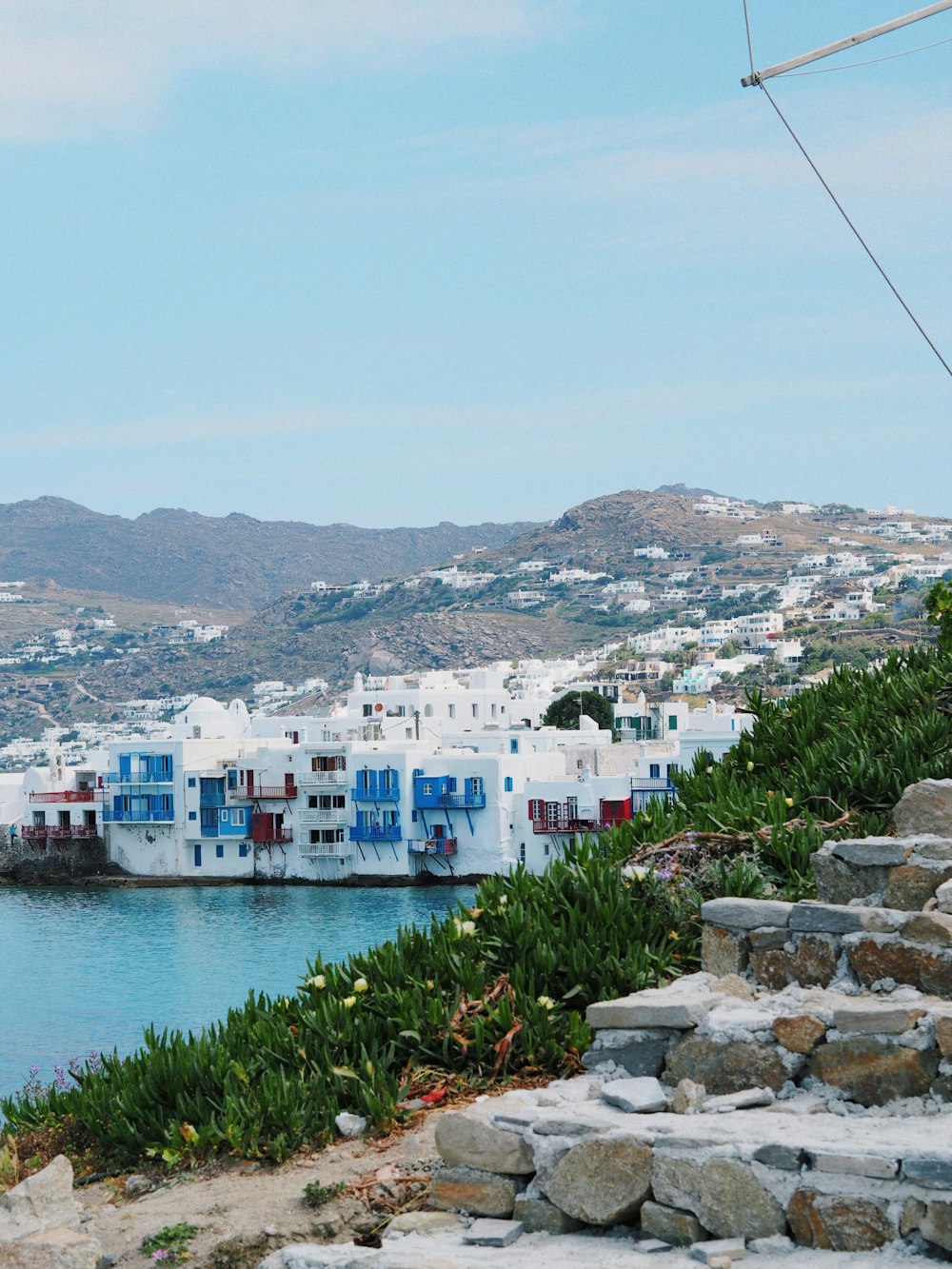 a scenic view of a town and a body of water