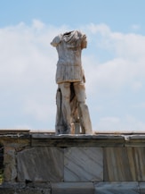 a statue of a woman on top of a building
