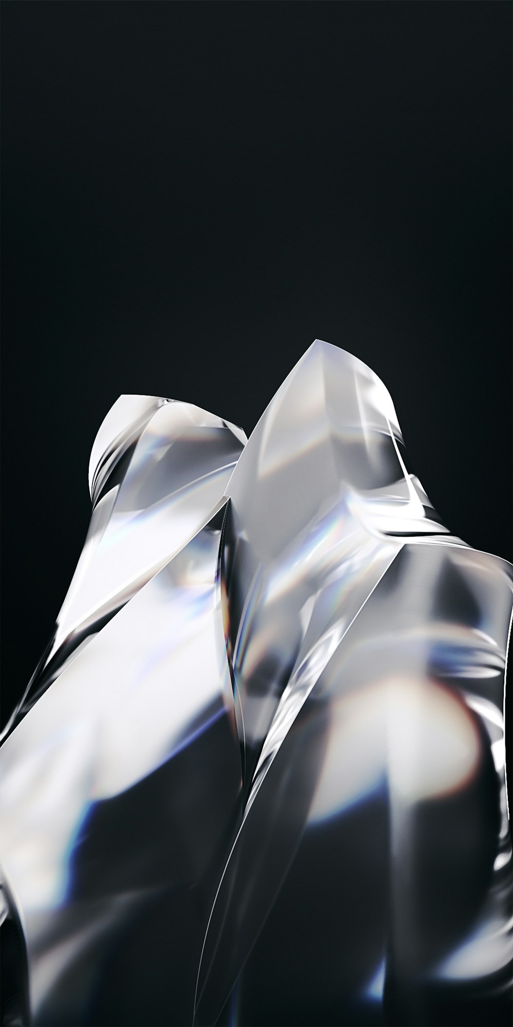 a shiny silver object with a black background