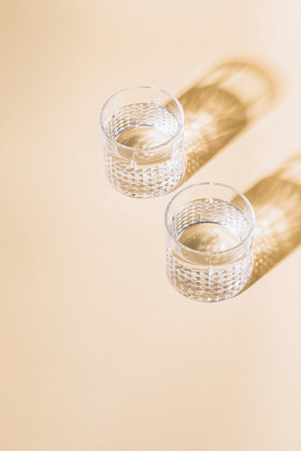 a couple of glasses sitting on top of a table