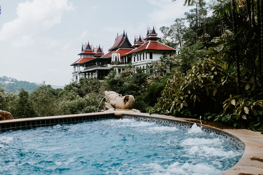 a large hot tub in front of a large house