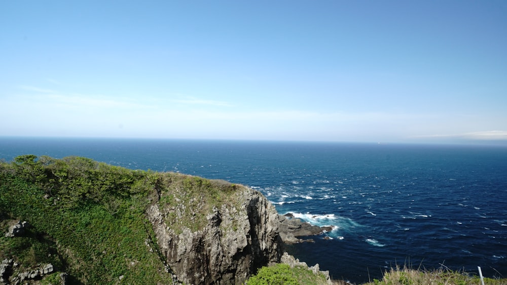 a view of the ocean from the top of a cliff