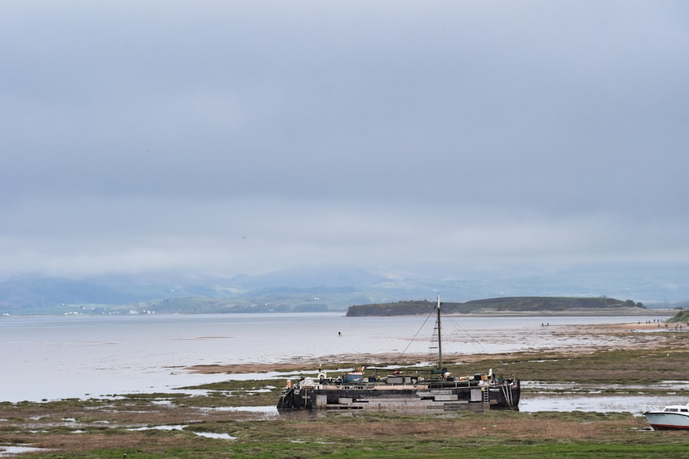 a boat sitting on top of a body of water