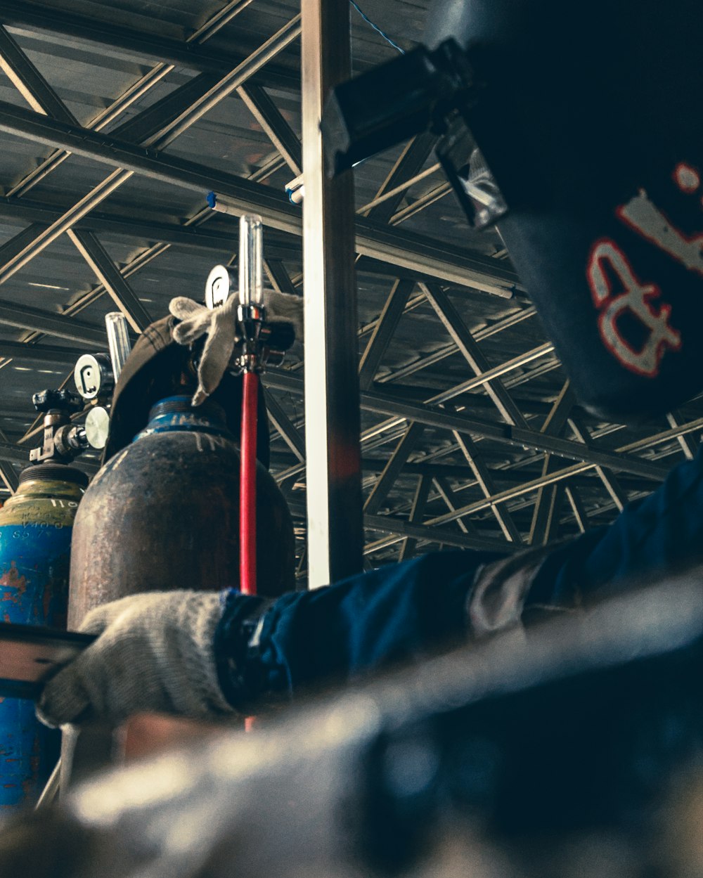 a person wearing gloves and gloves is working on a pipe