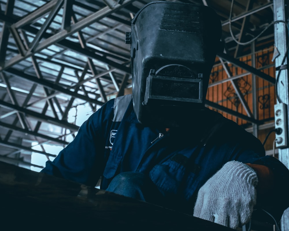 a man wearing a gas mask and gloves