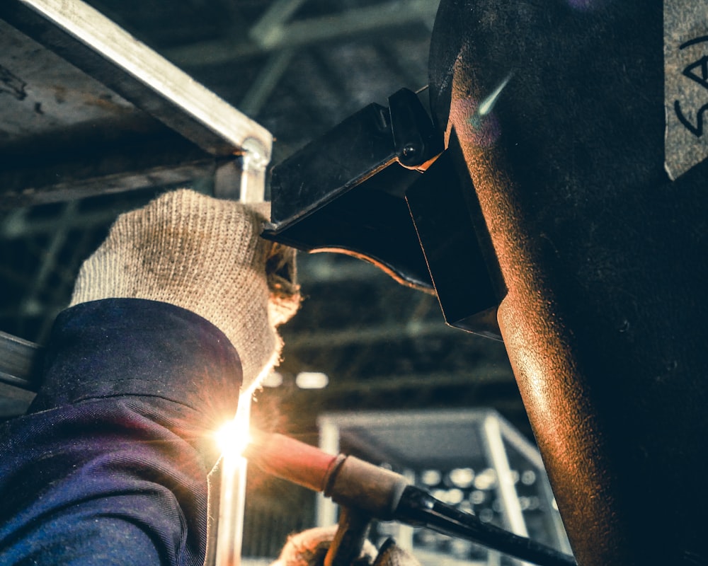 a man working on a piece of metal