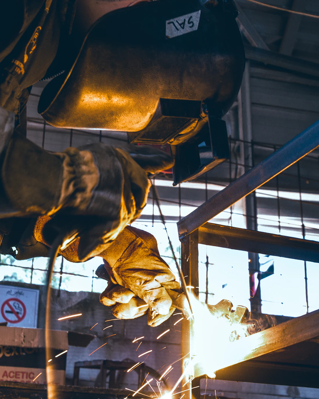 Metal fabrication professional welding a steel structure