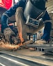 a man working on a piece of metal