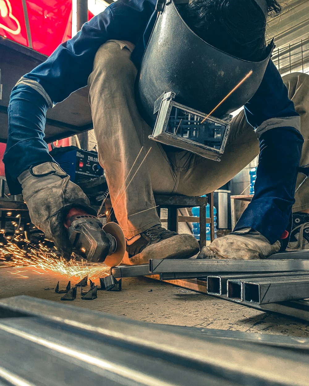 a man working on a piece of metal