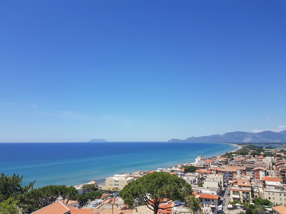 a view of a city next to the ocean