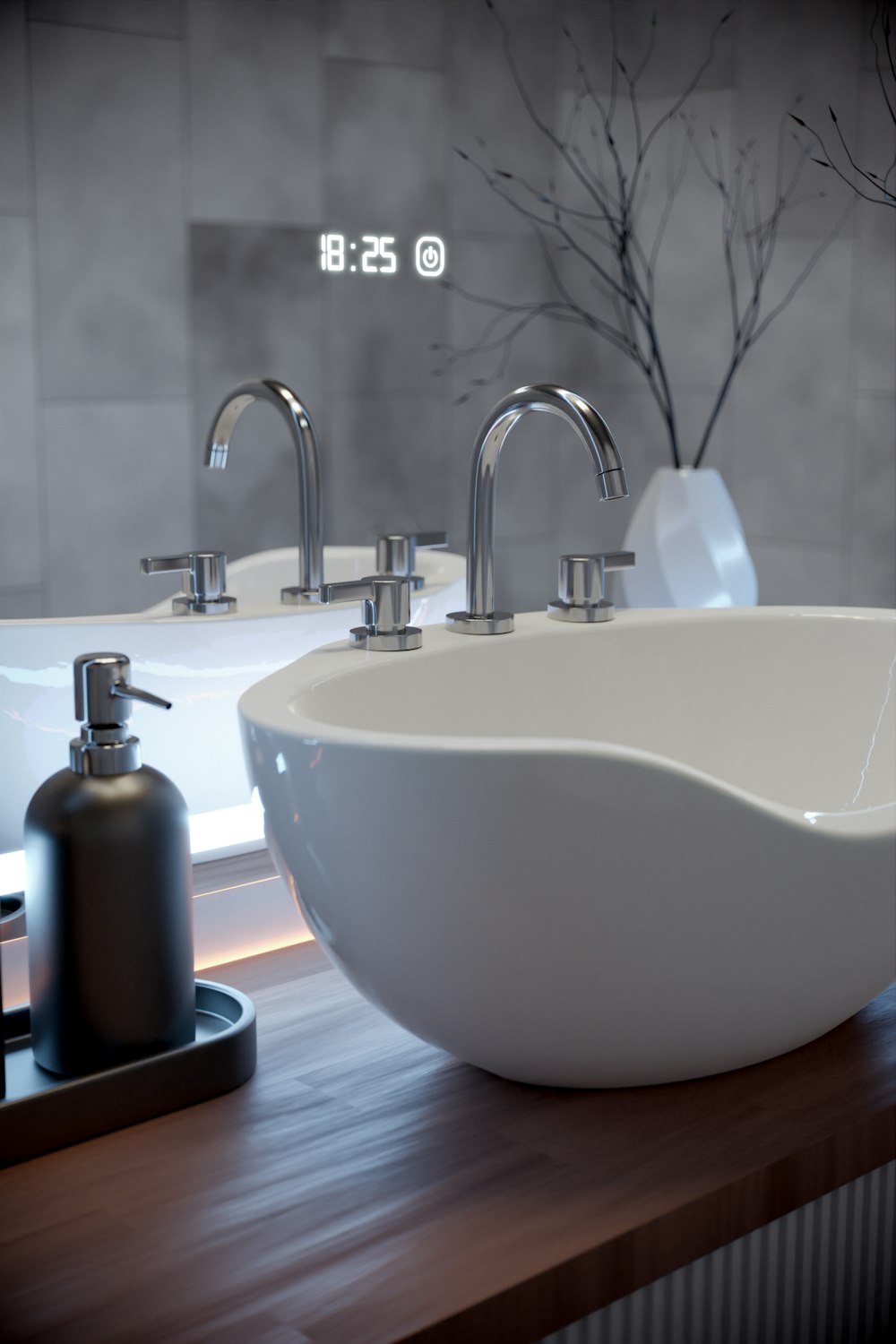 a bathroom sink with two faucets and a soap dispenser