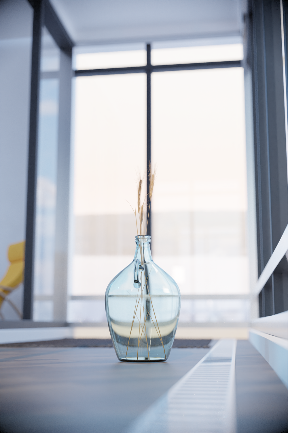 a glass vase with some reeds in it