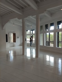 A clean, bright room with sunlight streaming through the windows.
