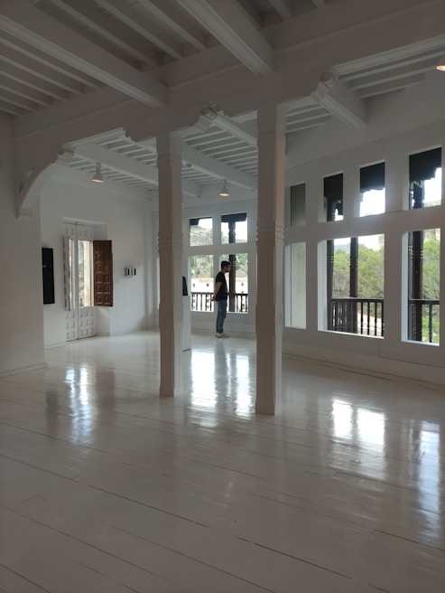 Bright living room with sparkling clean windows reflecting natural light