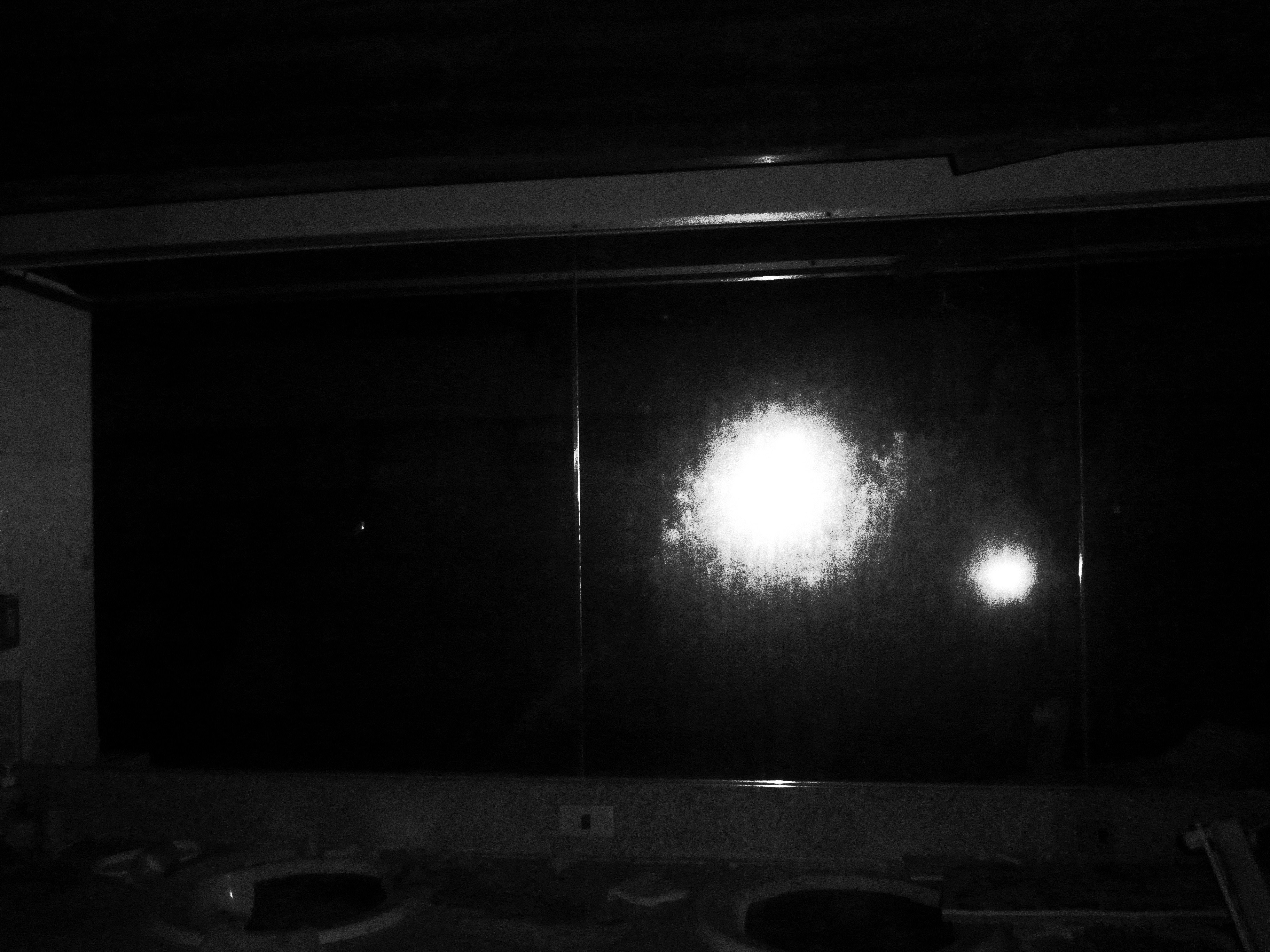 Close-up of a polished brass sink reflecting soft bathroom lighting