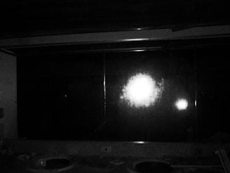 A sparkling clean bathroom mirror reflecting natural light.