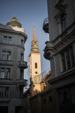a tall clock tower towering over a city