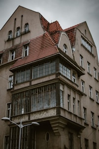 an old building with a red tiled roof