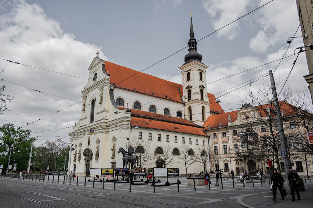 a large white building with a red roof