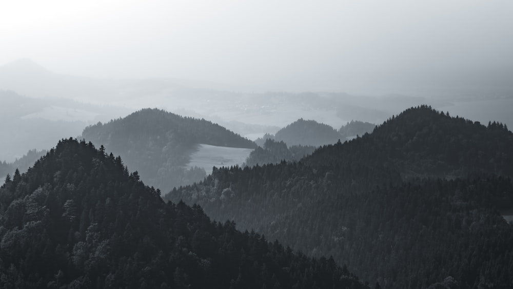 a black and white photo of a mountain range