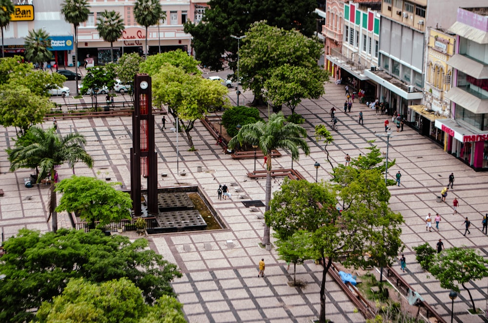 an aerial view of a city square with a clock tower