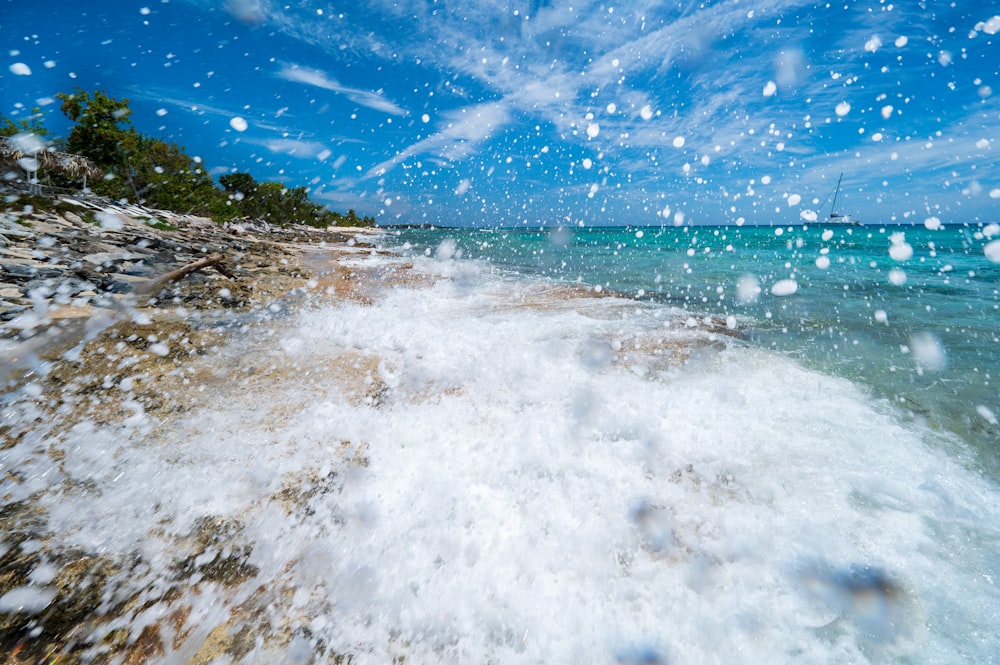 a view of the ocean from a rocky shore