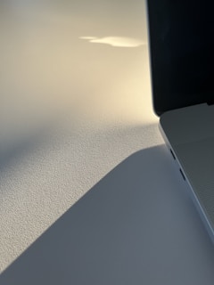 Side angle of a tech product highlighting its texture and details in monochrome