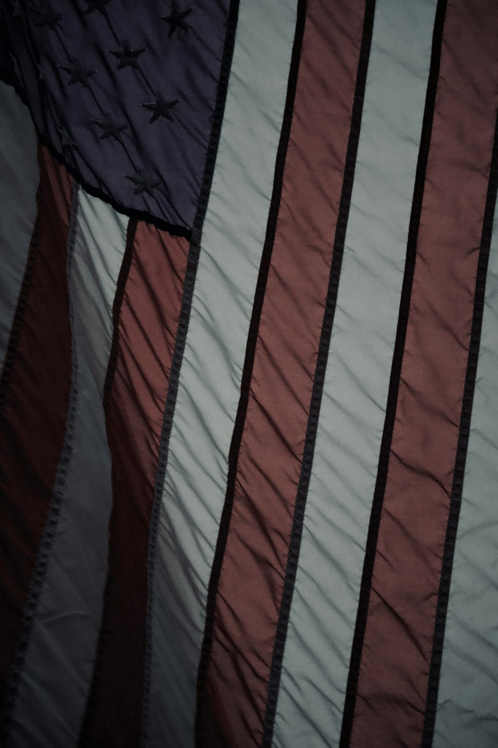 a close up of an american flag on a bed