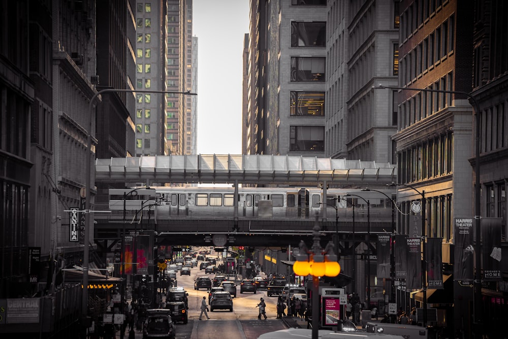 a city street filled with traffic and tall buildings